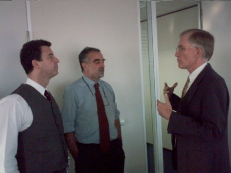 Deputy Prosecutor Serge Brammertz on the left, with Chief Prosecutor Luis Moreno-Ocampo and Mr. David Crane, in the interim seat of the ICC on 9 December 2003.