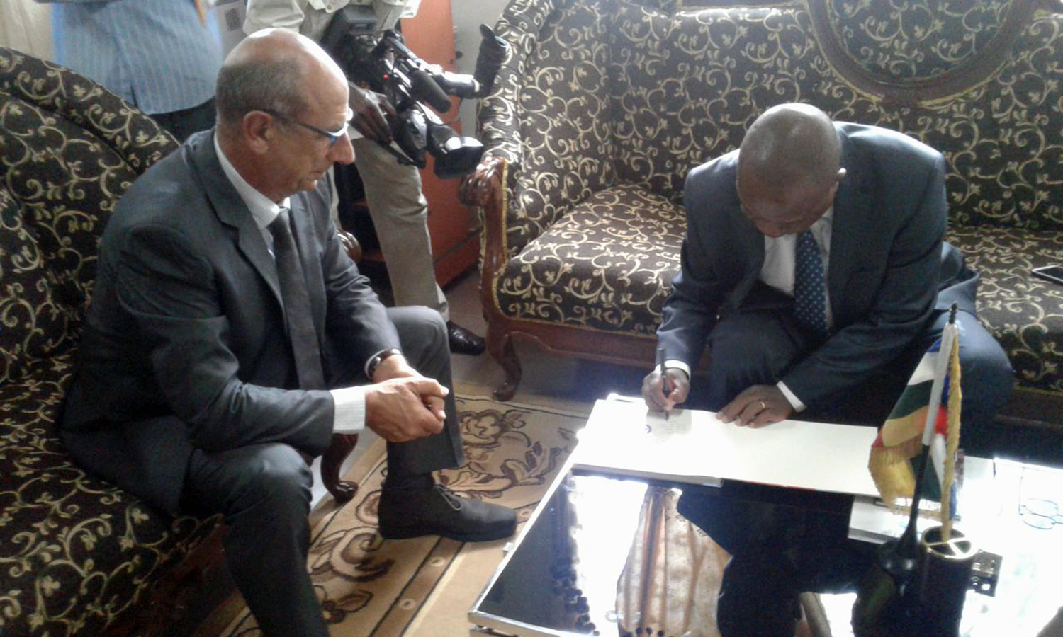 Justice Matters in the Central African Republic: CAR and the ICC sign guestbook symbolising mutual cooperation