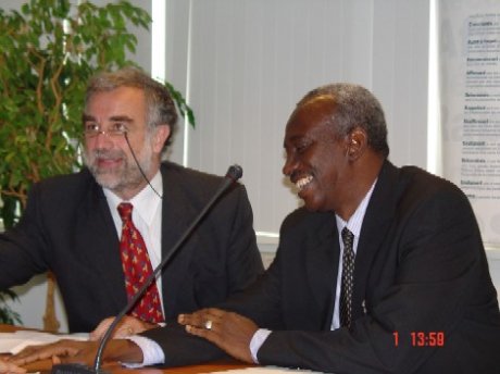 Chief Prosecutor Luis Moreno-Ocampo on the left, with Justice Hassan B. Jallow, in the interim seat of the ICC on 1 November 2004.