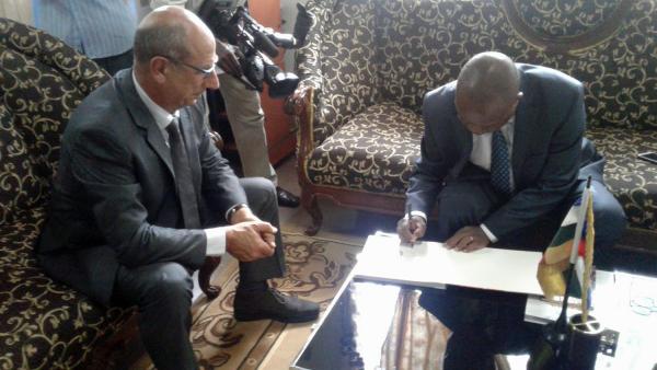 Justice Matters in the Central African Republic: CAR and the ICC sign guestbook symbolising mutual cooperation